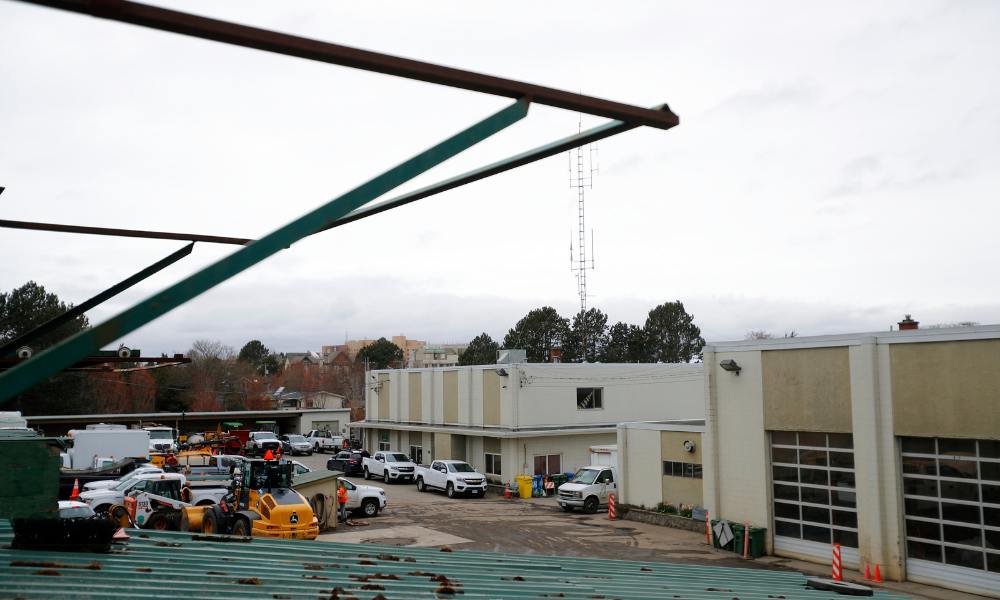 An aerial shot of the Oak Bay Public Works Yard, with commercial trucks and two vehicle docking bays for vehicle repair.